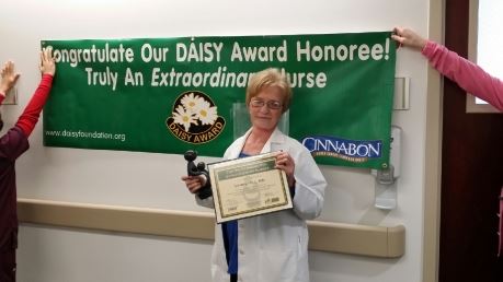 Lynn Hill accepting Daisy award